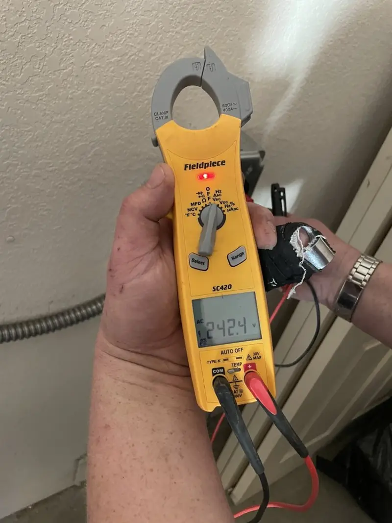 Voltage testing with clamp meter during Recessed Lighting Installation in Canyon Lake